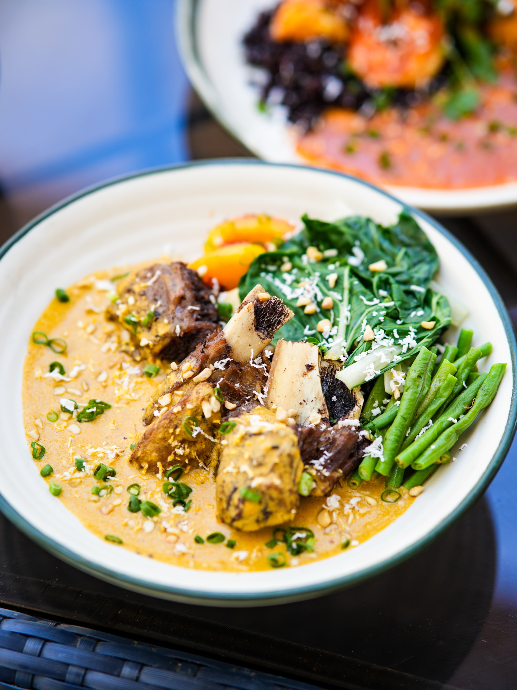 Nonie's kare-kare and sticky ribs served on the beachfront terrace at Ondus Hotel, Boracay